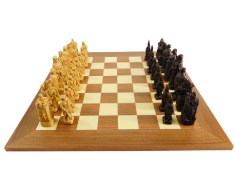 A Studio Anne Carlton chess set, decorated with resin figures of Scottish and British soldiers.