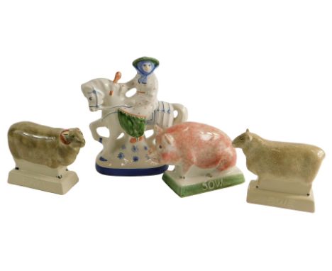 Three Rye pottery pigs, a ram, a ewe, and a sow, and a Rye pottery Staffordshire style figure on horseback. (4)