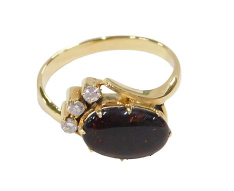 A 20thC opal and diamond crossover ring, the oval cabochon set brown/black opal, 11.5mm x 7.2mm x 4.5mm, approx 2.03ct, surro