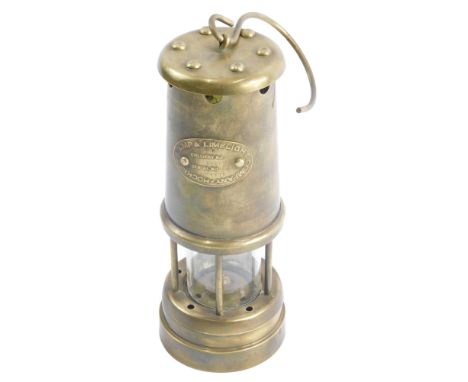 A Hockley Lamp and Lamp Light Company miner's lamp, and a reproduction brass candlestick telephone. (2)