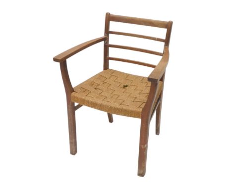 A lined oak open armchair, with a ladder back, and a woven seat.