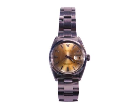 A Rolex Oyster Perpetual date automatic wristwatch, with gold coloured dial, stamped superlative chronometer, in a steel case