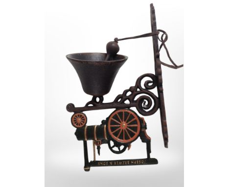 A cast-iron steam engine wall-mounted bell on bracket, length from wall 23cm.