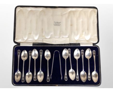 A cased set of twelve silver teaspoons and matching sugar tongs, retailed by David Summerfield, Newcastle on Tyne. CONDITION 