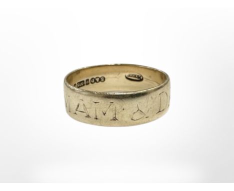 A 9ct gold band ring with inscription CONDITION REPORT: 2.8g
