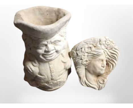 A concrete Toby jug planter, height 43 cm and a further wall mask 