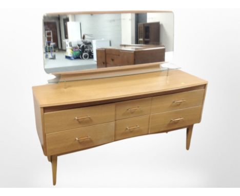 A Lebus oak mirror backed dressing table fitted six drawers, 140 cm x 42 cm x 122 cm 