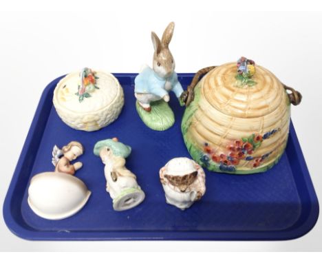 A Royal Winton biscuit jar in the form of a beehive, three Beswick Beatrix Potter figures, a Clarice Cliffe Newport pottery p
