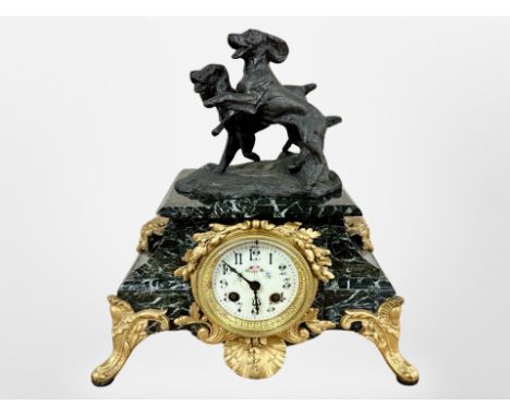 A 19th century green marble and gilt metal eight day mantel clock, later surmounted by two dogs, striking on a bell, with pen