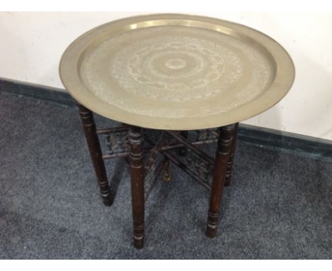 A bobbin turned folding occasional table with engraved brass top, diameter 58 cm 