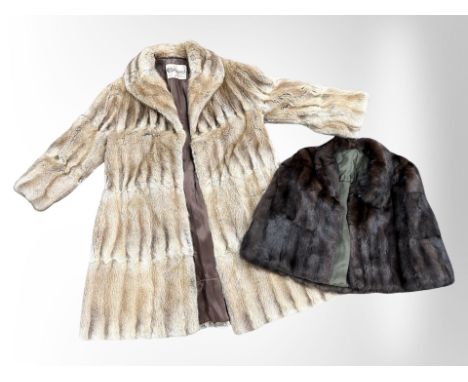 A light mink fur coat by Marcus of London, and a further dark mink shawl 