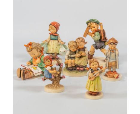 A collection of 7 Hummel statues. No: 8 - 346 - 427 - 410 - 141 3/0 - 557 - 175 