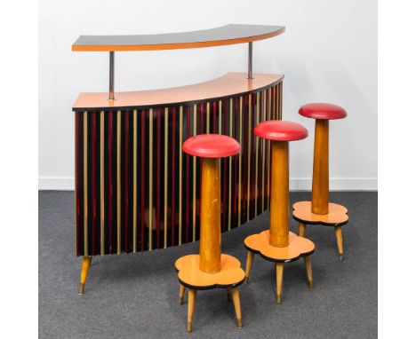 A vintage bar cabinet, made of formica and chrome, sided by 3 bar stools. 50 x 150 x 129