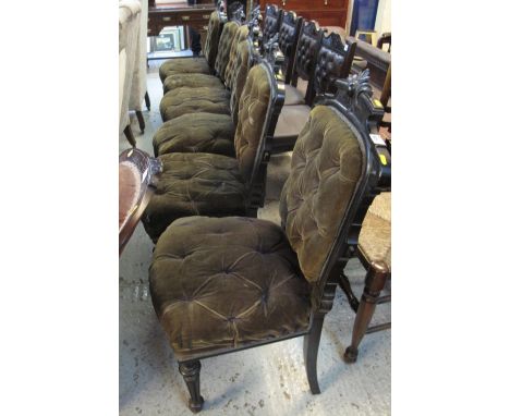 Set of six Victorian ebonised button back dining chairs on fluted legs and casters.  (6)