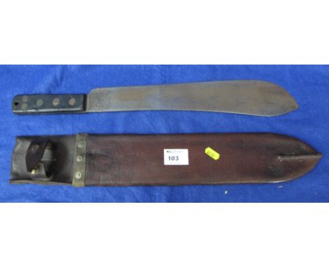 Bush knife or parang with wooden grips and leather scabbard.