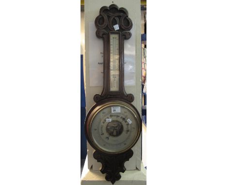 Early 20th Century oak wheel barometer, the face named: 'Pleasance and Harper, Swansea'.