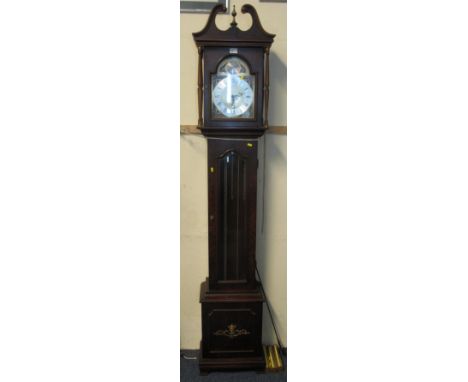 Mid 20th Century walnut finished long case clock, having brass face with silver chapter ring, glazed door revealing three bra
