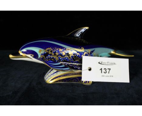 Royal Crown Derby bone china bottle nose dolphin paperweight with gold button stopper.