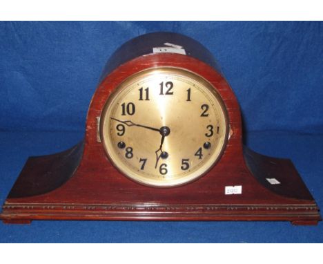 Mid 20th Century mahogany hat shaped three train mantel clock with silver Arabic face.
