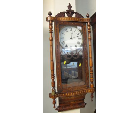 Walnut and mixed woods parquetry inlaid two train wall clock.
