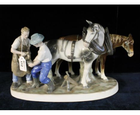 Continental ceramic study of blacksmiths with horses.