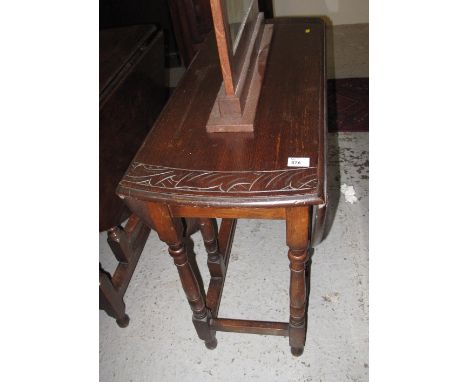 20th Century oak carved gate legged table.