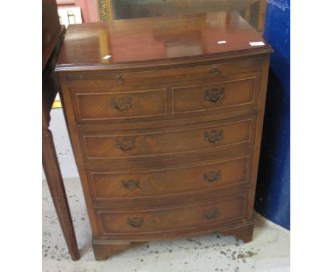 Reproduction mahogany bow front, narrow chest of four drawers on bracket feet.