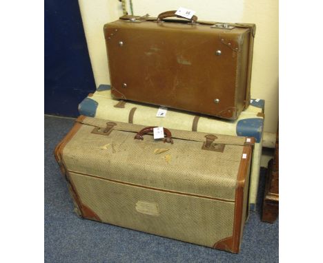 Three vintage suitcases.