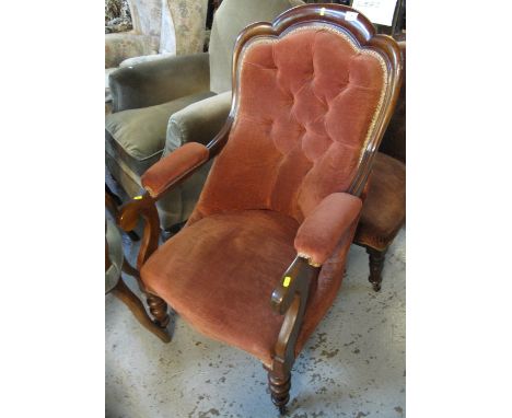 Late 19th/early 20th Century mahogany button back upholstered fireside armchair.