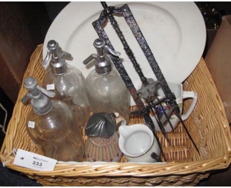 Modern wicker basket containing three vintage soda syphons; floral jug; large meat dish etc.