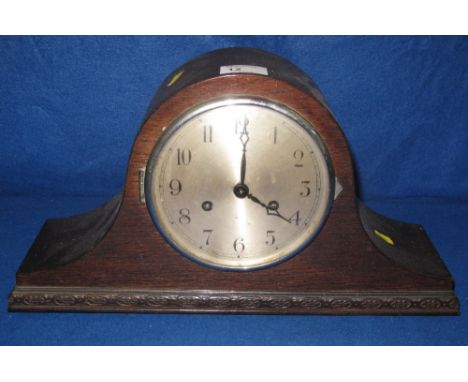 Mid 20th Century oak two train, hat shaped mantel clock with silvered Arabic face.