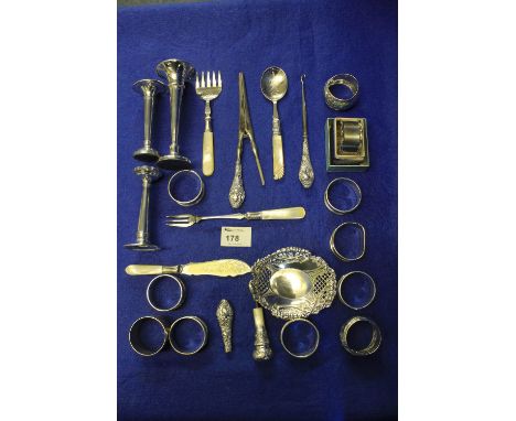 Bag of assorted silver and white metal items to include: assorted napkin rings; button hooks; flat ware; glove stretchers; tr