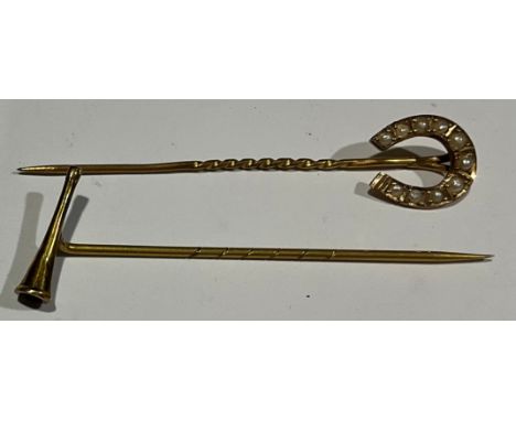 A 9ct gold stick pin, the terminal as a horseshoe, set with ten seed pearls, 5.5cm, marked 9ct, 0.97g, c.1900; another 9ct go