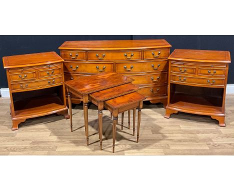 A George III style yew veneer bowfront chest of drawers, 74.5cm high, 126.5cm wide, 51cm deep; a pair of similar lamp or bedr