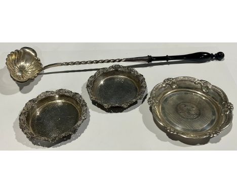 An early 20th century Christofle silver plated sauce ladle, spirally twisted stem, fluted bowl, ebonised handle, 38cm long ov