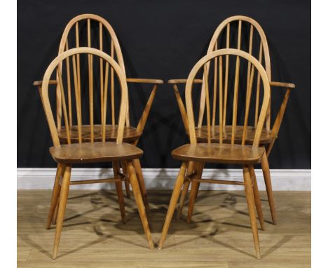 A pair of Ercol Quaker elbow chairs; a pair of Ercol Windsor side chairs (4)