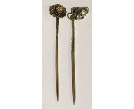 An Edwardian 15ct gold diamond set tie pin, stamped 15ct, 1.1g gross;  another paste three stone, stamped 9ct, 1.3g gross (2)
