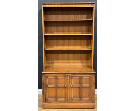 An Ercol bookcase, 196.5cm high, 98cm wide, 49.5cm deep