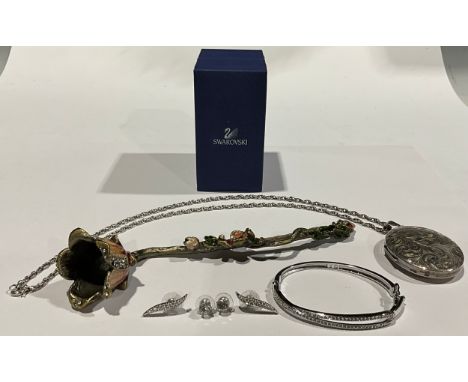 An Elizabeth II silver oval locket necklace and chain, the locket 5.5cm high, Birmingham 1976, 38g, boxed; a Swarovski base m