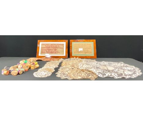 Textiles - a George V needlework alphabet sampler, by Wilde Dakin, aged 12 years, 1917, 15cm x 32.5cm; a needlework alphabet 