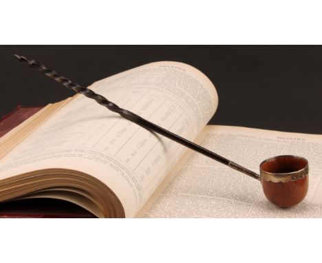 A George III silver mounted coquilla nut toddy ladle, wavy rim, twisted baleen handle, 30cm long overall, maker's mark WI? on