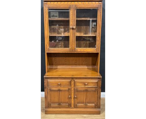 An Ercol bookcase or display cabinet, 196.5cm high, 98cm wide, 49.5cm deep