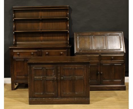 An Ercol dresser; an Ercol side cabinet; an Ercol bureau (3)