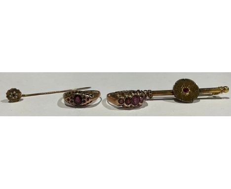 A selection of 9ct gold Garnet jewellery to include; two 9ct rose gold garnet rings, a garnet brooch and a garnet and seed pe