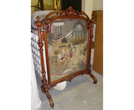 FIRESCREEN, the carved Victorian walnut frame enclosing a needlework panel, 83cm W x 118cm H. 