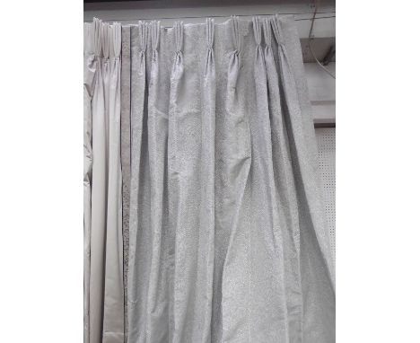 CURTAINS, two, in a woven silvery tessellated fabric, lined and interlined, one curtain approx 100cm W gathered, the other 12