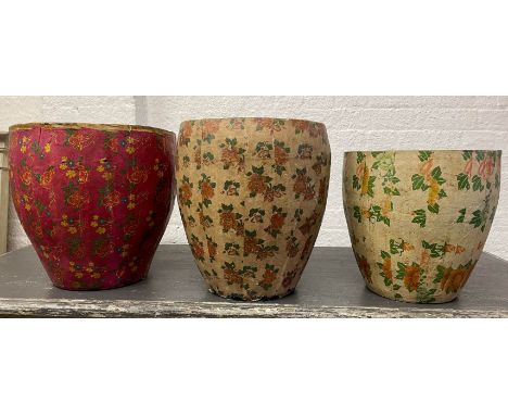 PAPIER MÂCHÉ CONTAINERS, a set of three, in vintage Chinese floral design, the larger red 39cm H x 39cm Diam, and two smaller