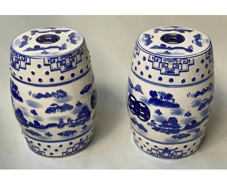CHINESE STOOLS, a pair, blue and white ceramic pierced barrel form, 46cm H. (2) 