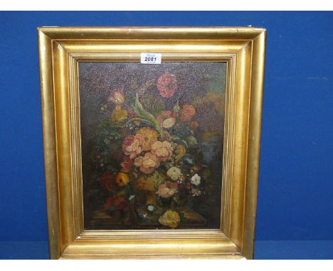 A framed Oleograph on panel depicting a still life of a vase of flowers.