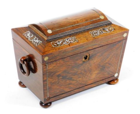 A Regency rosewood sarcophagus tea caddy, with mother of pearl inlay, ring handles and original fitted interior, 20cm.wide. (